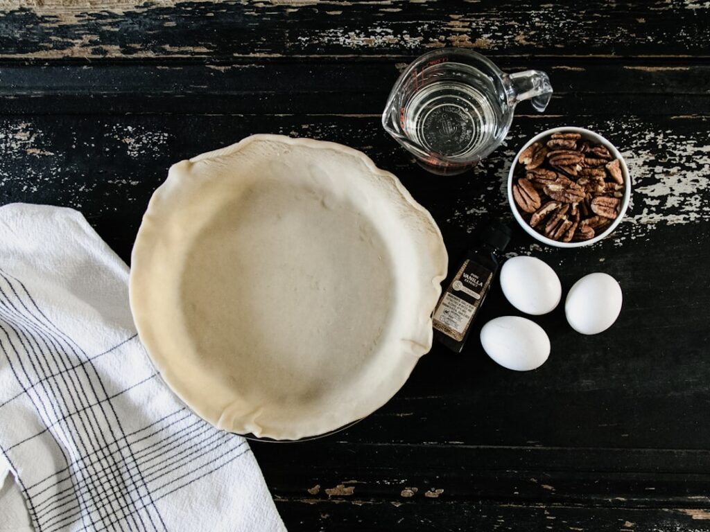 Golden brown, flaky high altitude pie crust cooling on a wire rack, showcasing its perfect texture.